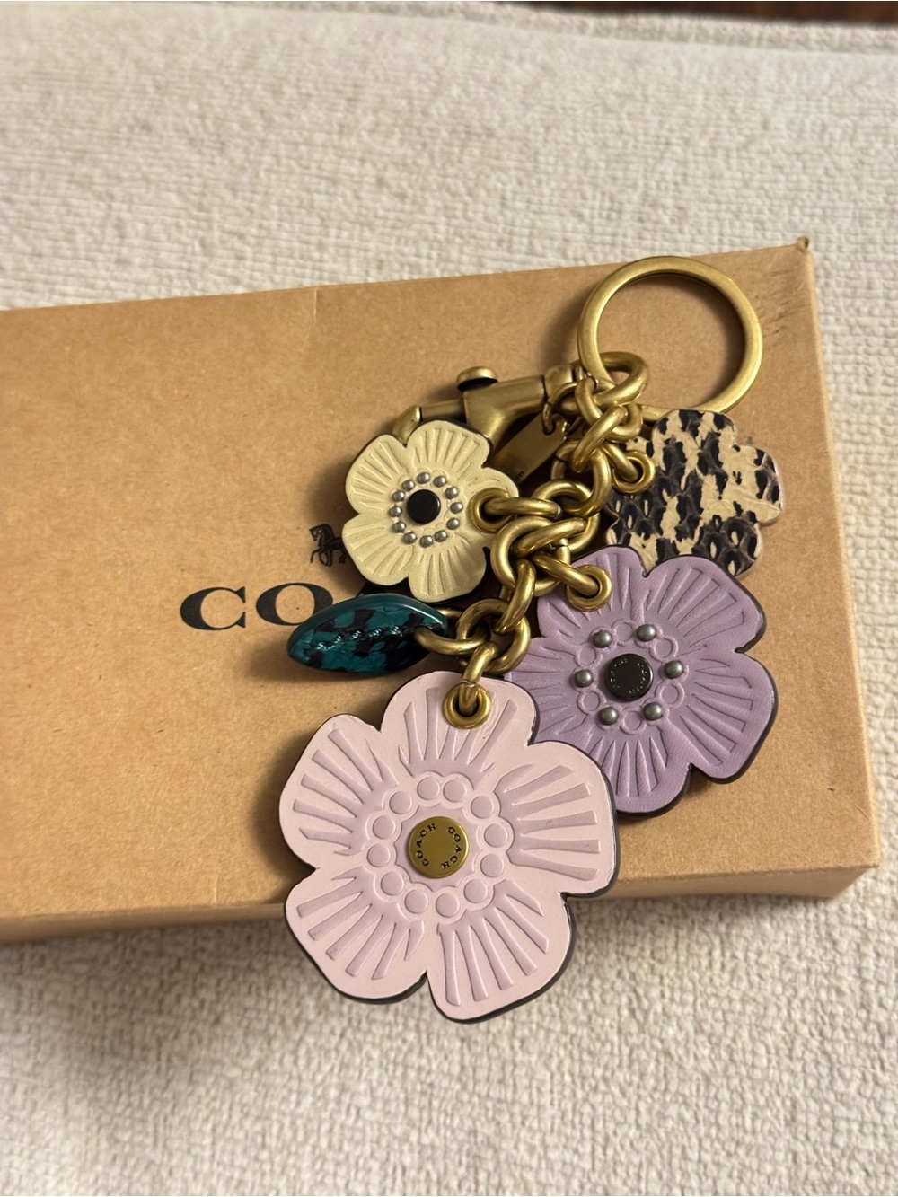 Coach Tea Rose charm in purple and cream